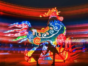Photo of the day: A Chinese couple poses with a rooster lantern display in Ningbo, east China's Zhejiang province, Feb. 13, 2017.