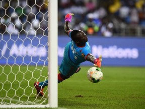 Photo of the day: Burkina Faso's goalkeeper Herve Kouakou Koffi stops the ball during the penalty shootout of the 2017 Africa Cup of Nations semi-final football match between Burkina Faso and Egypt at the Stade de l'Amitie Sino-Gabonaise in Libreville Feb. 1, 2017.