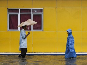 Photo of the day: Residents wade through floodwaters in Jakarta Feb. 21, 2017. Jakarta was hit by widespread flooding after hours of torrential rain, with thousands of homes inundated, cars stranded and people forced to wade through murky brown water.