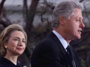 Bill Clinton is seen with Hillary Clinton in this file photo: Security will be tight when they visit Quebec next week.