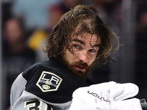 Peter Budaj #31 of the Los Angeles Kings reacts after losing his helmet during the third period of a 4-3 overtime shotout win against the Vancouver Canucks at Staples Center on October 22, 2016 in Los Angeles, California.