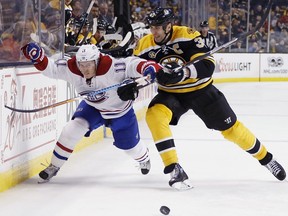 Boston Bruins' Zdeno Chara (33), of Slovakia, checks Montreal Canadiens' Brendan Gallagher (11) during the third period of an NHL hockey game in Boston, Sunday, Feb. 12, 2017. The Bruins won 4-0.