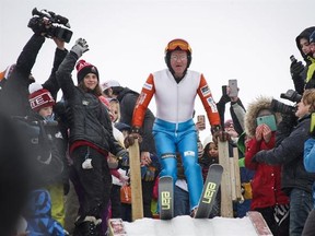 Michael Edwards, best known as &ampquot;Eddie the Eagle,&ampquot; prepares to start on the ski jump tower in Calgary, Alta., Sunday, March 5, 2017, 29 years after competing in the 1988 Calgary Olympics.THE CANADIAN PRESS/Jeff McIntosh