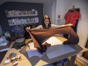Erica Penton prepares to flatten fabric for a sweater she was making, in the work space in her home in Halifax on Thursday, March 9, 2017. Save for her socks, she has made all of her own clothing for the last several years. THE CANADIAN PRESS/Stringer