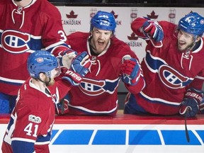Montreal Canadiens&#039; Paul Byron (41) celebrates with teammates Andrew Shaw (65) and Phillip Danault (24) after scoring against the Ottawa Senators during third period NHL hockey action in Montreal, Sunday, March 19, 2017. On paper, the Canadiens should be able to coast into the Stanley Cup playoffs.Beginning with a home game Tuesday night against Detroit, nine of Montreal&#039;s last 10 games of the regular season are against teams not currently in a playoff position. THE CANADIAN PRESS/Graham Hughes
