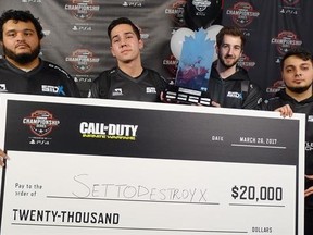 Team SetToDestroyX members Michael (Beehzy) Said of Brampton, Ont., left to right, Evan (HollerTV) Vart of Toronto, John (Xotic) Bruno of Cambridge, Ont., and Mehran (Mayhem) Anjomshoa of Toronto show off their $20,000 cheque for winning the Cineplex WorldGaming &ampquot;Call of Duty: Infinite Warfare&ampquot; tournament final in Toronto on Sunday, March 26, 2017. SetToDestroyX rallied to beat Team GIRG in an all-Ontario final at the Cineplex WorldGaming &ampquot;Call of Duty: Infinite Warfare&ampquot; tournament final Sunday.