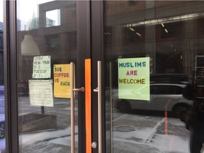 A sign – "Muslims are welcome" – is shown on the front door of Le Frigo Vert, a health-food coop on Mackay St., near Concordia University's downtown campus, on Thursday, March 2, 2017, a day after an anti-Muslim bomb threat led to an evacuation of thousands of Concordia students. Andy Riga / Montreal Gazette