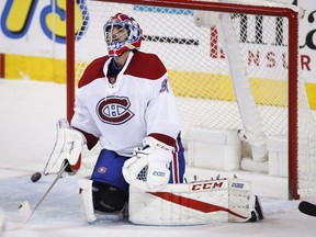 Montreal Canadiens goalie Al Montoya reacts to letting in a goal during second-period NHL hockey action against the Calgary Flames in Calgary, Thursday, March 9, 2017.