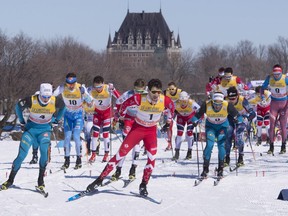 Canada's Alex Harvey (1) takes an early lead during the Men's 15 km Classic Mass Start, Saturday, March 18, 2017 at the FIS World Cup cross country finals in Quebec City.