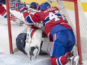Canadiens forward Alexander Radulov plows into Panthers goalie Reto Berra during second period Thursday night at the Bell Centre.