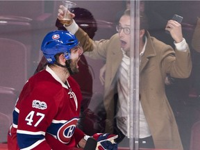 Excited fan celebrates Canadiens forward Alexander Radulov's goal during third period Tuesday night at the Bell Centre.