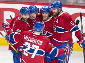 Montreal Canadiens left-wing Artturi Lehkonen (62) celebrates with teammates Alex Galchenyuk (27), Andrei Markov (79), Andrew Shaw (65) and Shea Weber (6) after scoring their third goal during third period NHL hockey action against the Dallas Stars, in Montreal on Tuesday, March 28, 2017.