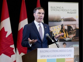 Canadian Finance Minister Bill Morneau speaks during a press conference at the media lockup, before tabling the budget in the House of Commons on Parliament Hill, in Ottawa on Wednesday, March 22, 2017.
