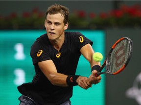 Vasek Pospisil of Canada plays a backhand during his straight sets victory against Andy Murray of Great Britain in their second round match during day six of the BNP Paribas Open at Indian Wells Tennis Garden on March 11, 2017 in Indian Wells, California.