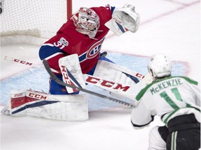 Canadiens goalie Carey Price makes the save on Dallas Stars left-wing Curtis McKenzie during second period NHL hockey action in Montreal, Tuesday, March 28, 2017.