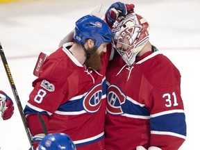 Montreal Canadiens goalie Carey Price (31) is congratulated by Montreal Canadiens defenceman Jordie Benn (8) after defeating the Dallas Stars 4-1 following NHL hockey action, in Montreal on Tuesday, March 28, 2017.