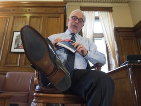 Quebec Finance Minister Carlos Leitão  shows off his new shoes on the eve of a provincial budget speech Monday, March 27, 2017 in Quebec City.
