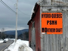 The proposed Northern Pass transmission line has generated widespread opposition. Protest signs, such as this one outside of Colebrook, N.H., are quite common. The transmission line would be used by Hydro-Québec to export power to the New England grid that serves six states including New Hampshire.
