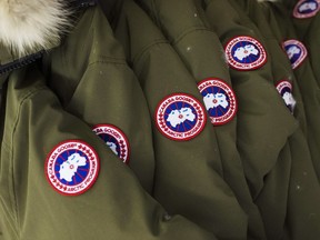 Jackets hang at the factory of Canada Goose Inc. in Toronto on Thursday, November 28, 2013. The head of Canada Goose is setting his sights on India and other parts of Asia as he looks beyond cold weather for future growth in the jacket business. Dani Reiss concedes that stocking shelves in warm climates might seem usual, but he says it makes sense for the company's high-end outerwear, which has become a fashion statement as well as a way to stay warm.