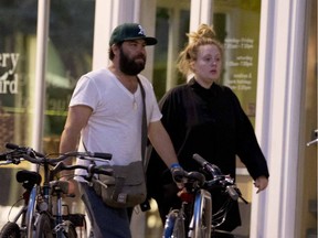 In this file photo, singer and performing artist Adele Adkins is seen, sans makeup, with Simon Konecki in London.