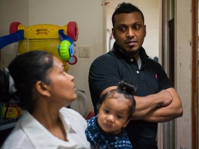Supun Thilina Kellapatha and his partner Nadeeka holding their baby boy Danath. The Sri Lankan refugees who helped shelter fugitive whistleblower Edward Snowden are seeking asylum in Canada.
