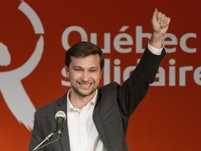 Gabriel Nadeau-Dubois smiles during an event in Montreal, Sunday, March 26, 2017, announcing him as Quebec Solidaire's nominee for the riding of Gouin in an upcoming byelection.