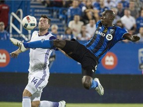 Montreal Impact defender Hassoun Camara kicks the ball away from Orlando City FC defender Luke Boden during first half MLS action Wednesday, September 7, 2016 in Montreal. The Montreal Impact are looking to open the regular season with an away victory for a second year in a row when they face the Earthquakes in San Jose.