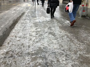 Pedestrians walk on icy sidewalks in downtown Montreal in this March 2017 file photo.
