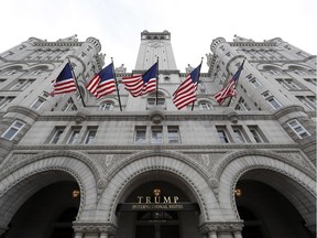In this photo taken Dec. 21, 2016, the Trump International Hotel in Washington. Trump's $200 million hotel inside the federally owned Old Post Office building has become the place to see, be seen, drink, network, even live, for the still-emerging Trump set.