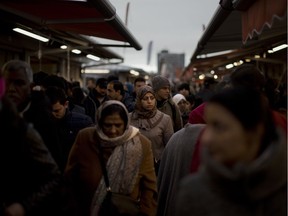 In The Hague's most culturally diverse neighbourhoods, many women wear Muslim headscarves. In the market, young Muslim women eating battered fried fish, a Dutch favourite, took dainty, careful bites to avoid splashing grease on their hijabs.