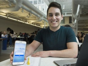 Dawson college student Joshua Miglialo poses with his phone app, BreakBuddy, in the Dawson break area in Montreal on Wednesday, March 1, 2017.