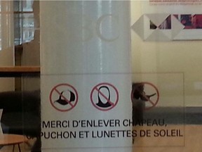 Laval resident Murielle Salari feels a pictogram used by HSBC Canada branches to illustrate a dress code for customers looks like the bank prohibits hijabs. Pictured is one at a Laval branch.