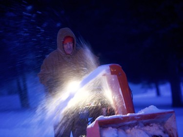 Allan Meckley clears a path with a snowblower March 14, 2017 in Stevens, Pennsylvania. Snow was continuing Wednesday across much of the northeast United States and Canada, including Montreal.
