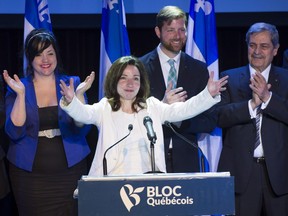 Newly acclaimed Bloc Quebecois leader Martine Ouellet salutes supporters during a rally Saturday, March 18, 2017 in Montreal.
