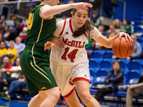 McGill Martlets' Jenn Silver dribbles past Regina Cougars player during the USports Women's Basketball Championship quarter-finals on Thursday, March 9. PHOTO CREDIT: Amando Tura, UVIC