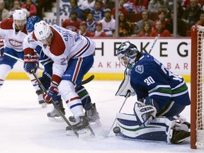 Canadiens centre Alex Galchenyuktries to get a shot past Canucks goalie Ryan Miller Tuesday night. Galchenyuk has scored at least one point in six straight games.