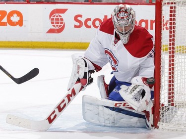 Carey Price #31 of the Montreal Canadiens makes a glove save against the Ottawa Senators in the second period at Canadian Tire Centre on March 18, 2017 in Ottawa.