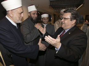 Mayor Denis Coderre, right, was among elected officials honoured at a dinner held by the Muslim community on Tuesday.