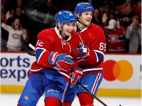 Canadiens left wing Artturi Lehkonen, left, and centre Andrew Shaw celebrate scoring against Colorado Avalanche goalie Calvin Pickard during NHL action at the Bell Centre in Montreal on Saturday December 10, 2016.