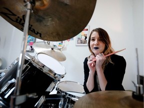 Olivia Pipe plays the drums in her Little Burgundy apartment.