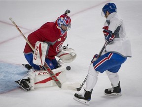 MONTREAL, QUE.: FEBRUARY 19, 2017 --   Torrey Mitchell right, takes the puck to the net of Al Montoya during the teams annual open practice at the Bell centre in Montreal, on Sunday, February 19, 2017. (Peter McCabe / MONTREAL GAZETTE) ORG XMIT: 58144
