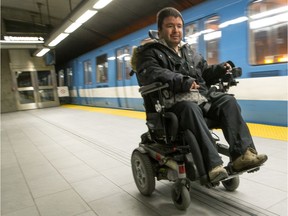 Martin Dion rides his wheelchair on the platform at the Henri Bourassa metro station in Montreal, Thursday January 16, 2017. Dion has muscular dystrophy but uses public transport to get around.