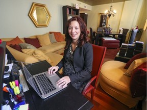 Aurore Bonvalot works at a desk in the corner of the living room of the Old Montreal condominium she shares with husband Pierre Martineau.