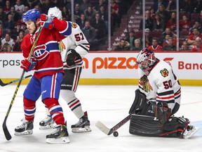 Chicago Blackhawks goalie Corey Crawford makes a save behind Montreal Canadiens Andrew Shaw and Hawks Trevor van Riemsdyk during third period of National Hockey League game in Montreal Tuesday March 14, 2017.