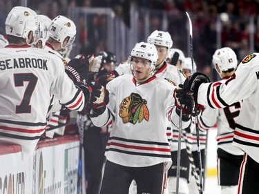 Chicago Blackhawks Patrick Kane is congratulated by teammates after scoring goal during first period of National Hockey League game in Montreal Tuesday March 14, 2017.