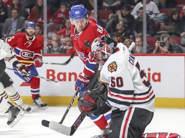 Montreal Canadiens Alex Radulov looks for the rebound as Chicago Blackhawks Corey Crawford makes a save during first period of National Hockey League game in Montreal Tuesday March 14, 2017.