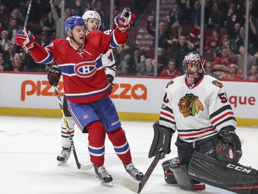 Montreal Canadiens Alex Radulov celebrates teammate Shea Weber's goal in front of Chicago Blackhawks goalie Corey Crawford during third period of National Hockey League game in Montreal Tuesday March 14, 2017.