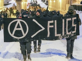 Anti-police brutality demonstrators march west on Ontario St. in Hochelaga-Maisonneuve to downtown Montreal Wednesday March 15, 2017.