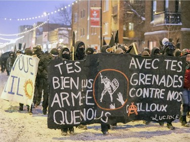 Anti-police brutality demonstrators march west on Ontario St. in Hochelaga-Maisonneuve to downtown Montreal Wednesday March 15, 2017.