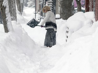 Marsha Goldberg shovels her front walk on Walker St. in Montreal Wednesday March 15, 2017.